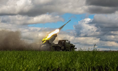 A BM-21 'Grad' multiple rocket launcher fires towards Russian positions in the Donetsk region.