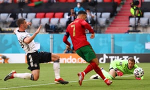 Manuel Neuer of Germany looks on as Cristiano Ronaldo of Portugal scores the opening goal.