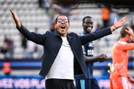 Liam Rosenior celebrates Paris FC's win in front of the travelling Strasbourg fans