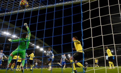 Brighton’s Adam Webster (centre) powers a header past Chelsea’s goalkeeper Kepa Arrizabalaga to get the home side back on level terms.