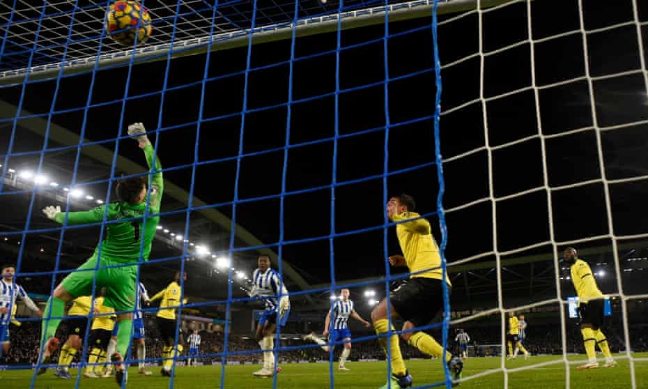 Brighton’s Adam Webster (centre) powers a header past Chelsea’s goalkeeper Kepa Arrizabalaga to get the home side back on level terms.