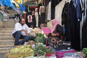 Chef Fadi Kattan talks to Um Nabil, ‘the queen of herbs’, in Bethlehem market. The chef plans to open his first Palestinian restaurant, Akub, in London’s Notting Hill.