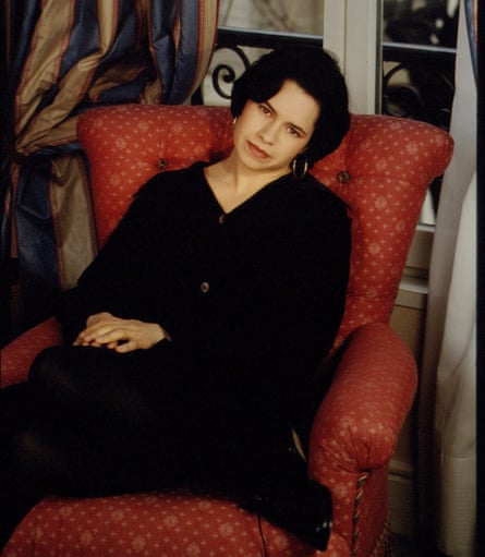 Natalie Merchant of 10,000 Maniacs sitting in a chair dressed all in black
