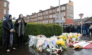 Tributes left at a memorial for Asad Shah, who was killed in what police are treating as a ‘religiously prejudiced’ attack.