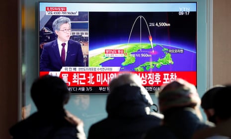 People watch a television broadcast of a news report on North Korea firing what appeared to be an intercontinental ballistic missile (ICBM) that landed close to Japan, in Seoul, South Korea. 