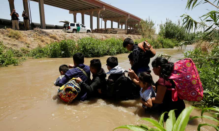 Migrants from Guatemala cross the Rio Bravo
