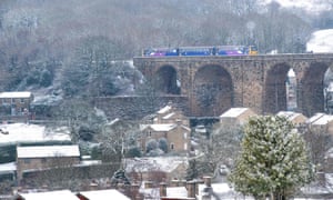 A train crosses the viaduct in Denby Dale, northern England, as freezing temperatures persist across Britain. 