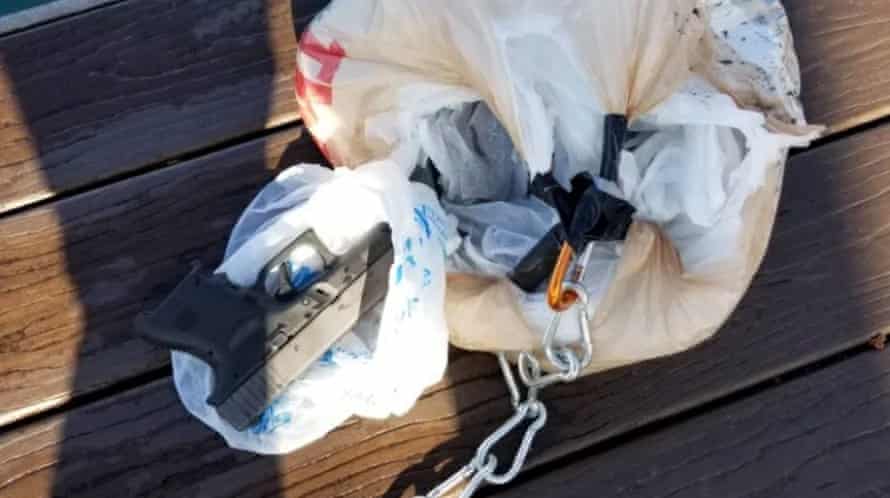 11 handguns were found in a bag attached the drone