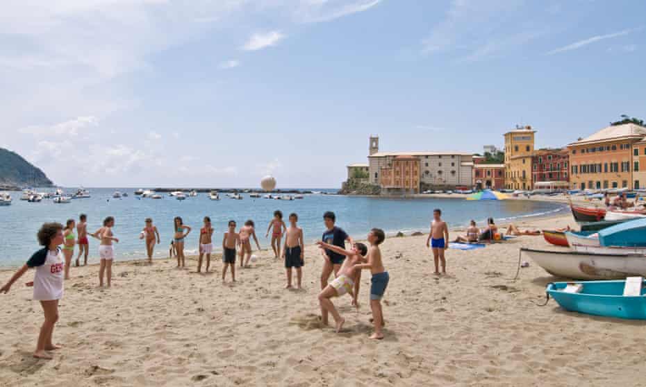 Children play on the beach of Sestri Levante, Italy.