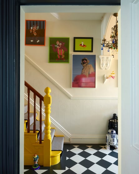 Bold, colourful artworks sit alongside the Selfridges-yellow staircase.