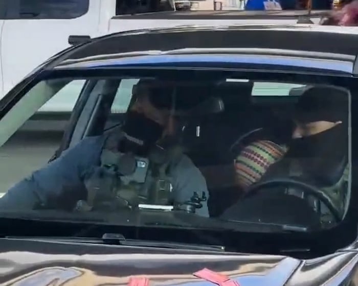 Armed US immigration agents drive off with toddler after arrest of father