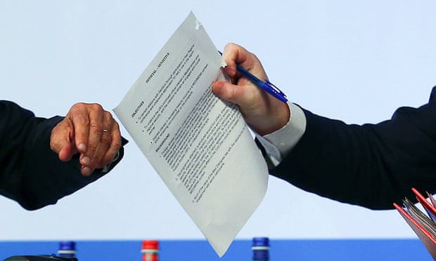 Foreign secretary holds the document marked sensitive.