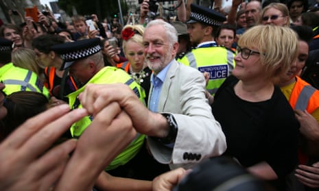 Jeremy Corbyn greets supporters after speaking in Parliament Square during an anti-austerity demonstration on 1 July in London. 