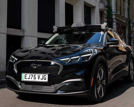 A Wayve self-driving taxi on a street