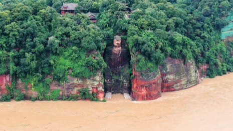 China floods: Leshan Giant Buddha statue at risk after torrential rainfall – video