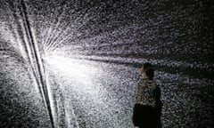 A visitor looks at an installation by artist Ryoji Ikeda at the Big Bang Data exhibition, Somerset House.