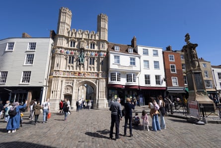 Tourists outside the Christ Church Gate leading to Canterbury Cathedral