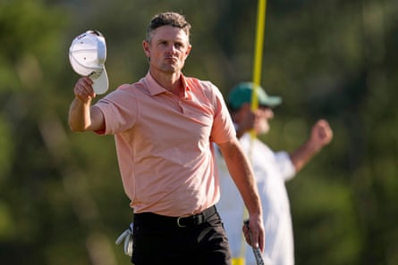 Justin Rose lifts his cap