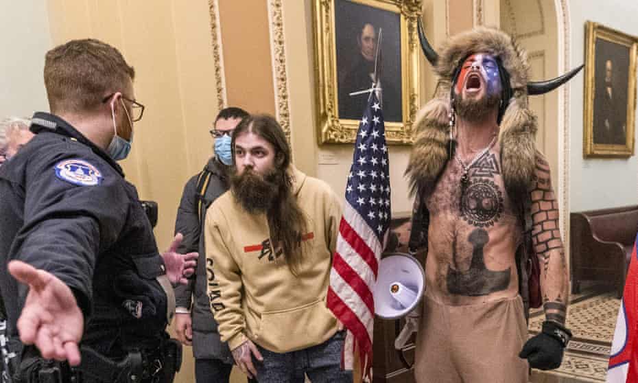 Jacob Chansley, right with fur hat, during the Capitol riot in Washington on 6 January.