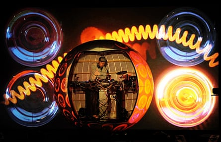 DJ Shadow performs inside an elaborate spherical stage set