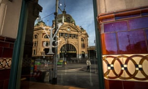 The reflection of Flinders Street Station in the window of Young and Jackson pub in Melbourne on Tuesday. Lockdown will ease in Victoria tonight but cold and windy weather will sweet the state on Wednesday.