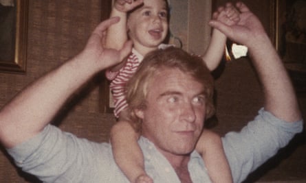 old photo of man with a child on his shoulders