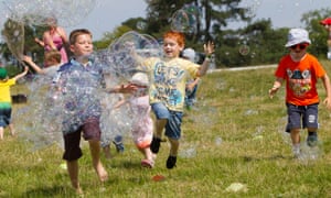 Kids enjoying bubble-blowing at the Deer Shed Festival, North Yorkshire.