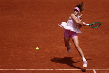 Mirra Andreeva fires off a forehand return to Marie Bouzkova.