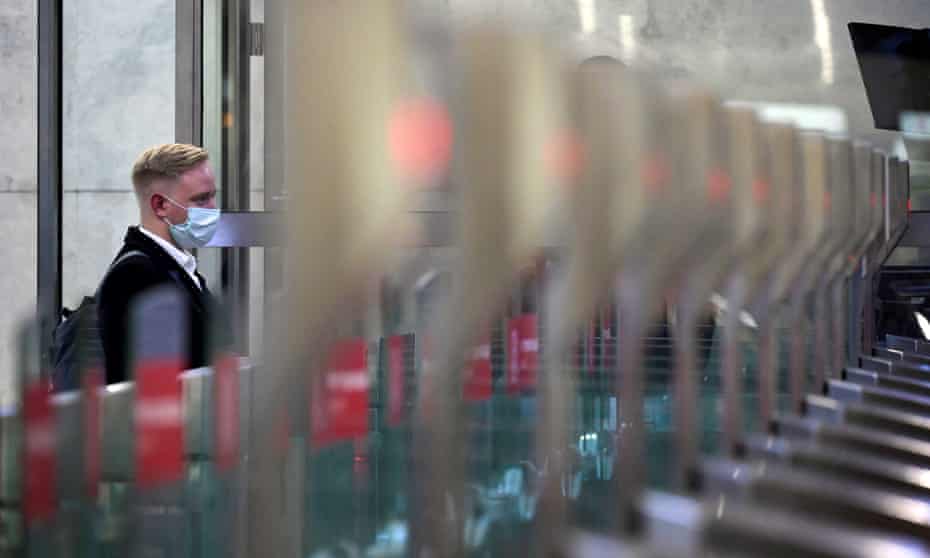 A passenger walks through a ticket gate equipped with Face Pay at Turgenevskaya metro station in Moscow