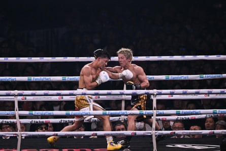 Naoya Inoue and Junto Nakatani trade punches during Saturday's fight at the Tokyo Dome.