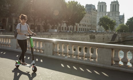 Katy Lee on a Lime e-scooter in Paris.