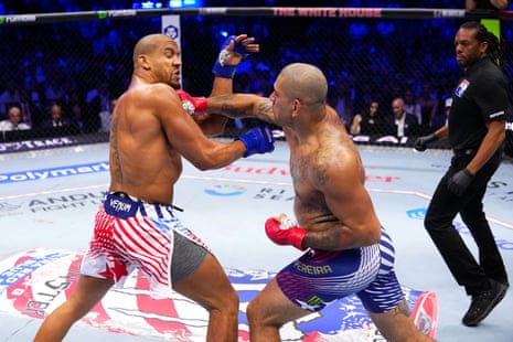 Alex Pereira of Brazil strikes Ciryl Gane of France during their UFC interim heavyweight championship fight on Sunday night.