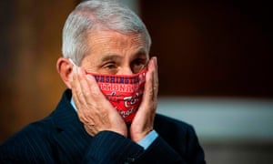 Home alone? At least Pence is wearing a mask now. Anthony Fauci in a Washington Nationals baseball team tribute mask, before testifying on Capitol Hill last week, where he repeatedly contradicted Pence and Donald Trump’s misleading remarks on Covid-19.