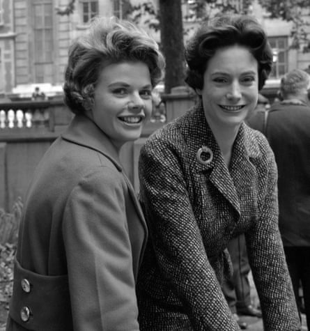 Judith Chalmers and Nan Winton smiling as they side next to each other