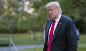 Donald Trump walks on the South Lawn after arriving on Marine One at the White House in Washington on 25 June.
