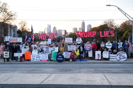 Protesters wait for the arrival of federal law enforcement on 18 November 2025 in Charlotte.