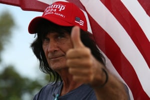 A supporter of former US president Donald Trump does a thumbs-up at a small gathering near Mar-a-Lago on Thursday.