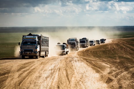 Trucks full of people arrive at a civilian screening point for suspected Isis families, on 11 February 2019