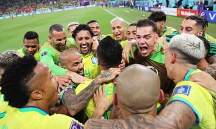 Casemiro’s teammates show their appreciation after he scored Brazil’s winner against Switzerland.