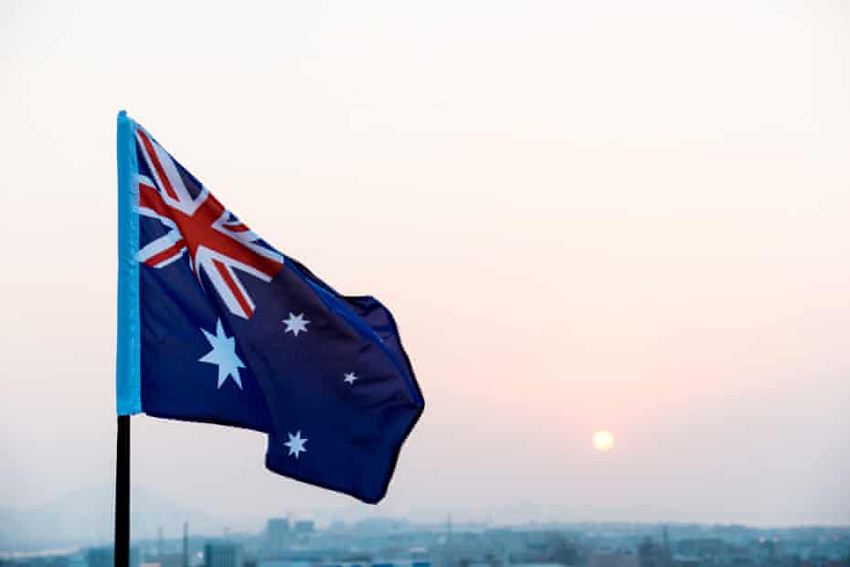 Australia national flag at sunset.