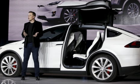 Tesla Motors CEO Elon Musk introduces the falcon wing door on the Model X electric sports-utility vehicles during a presentation in Fremont, California in September 2015. 