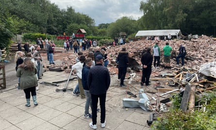 Locals inspect the remains of the Crooked House pub in Himley.