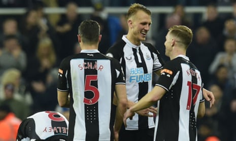 Dan Burn and Newcastle players celebrate after their win over Crystal Palace.