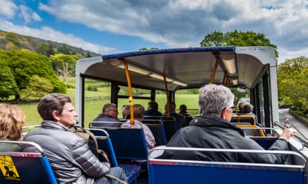 Visitors on the open top 599 service bus from Bowness on Windermere to Grasmere.