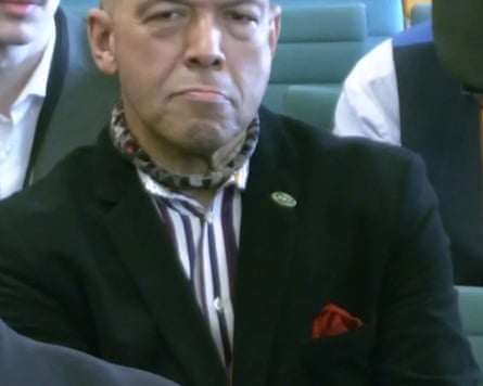 Andrew Edwards in a colourful cravat and striped shirt with a red pocket handkerchief