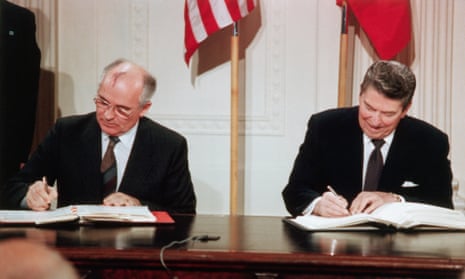 Soviet Leader Mikhail Gorbachev and President Ronald Reagan sign the Intermediate-range Nuclear Forces (INF) agreement in the East Room of the White House on 8 December 1987.