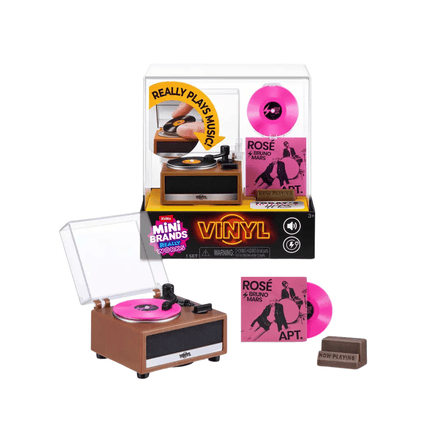 A toy record player play set with pink vinyl record, packaging box, and small sleeve