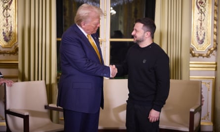 Donald Trump shakes hands with the Ukrainian president, Volodymyr Zelenskyy in Paris on Saturday.
