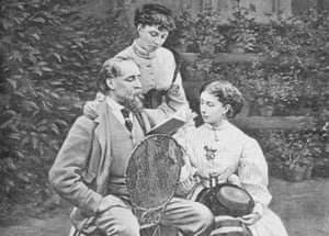 Charles Dickens reading to two of his daughters in the garden of his home, Gadâs Hill, in Kent.
