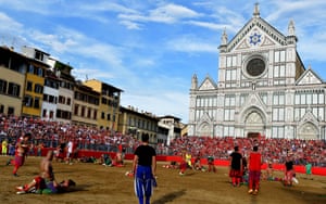 Players compete during the final match of the Calcio Storico Fiorentino (Historic Florentine Football) on Piazza Santa Croce in Florence